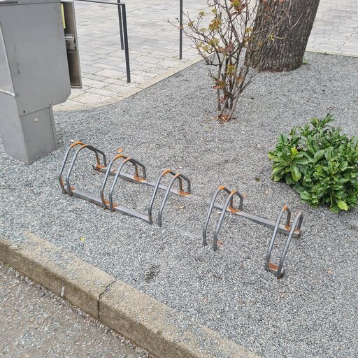A bicycle rack at a curbside